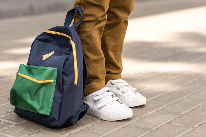 back to school shopping kid with backpack
