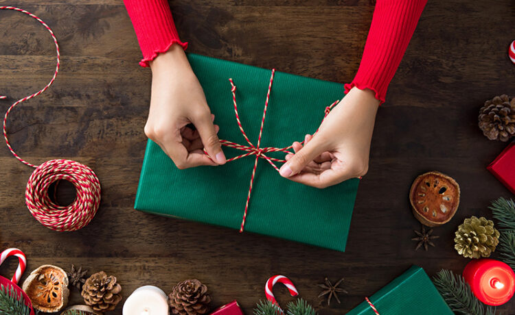 A person wrapping; Christmas gift ideas