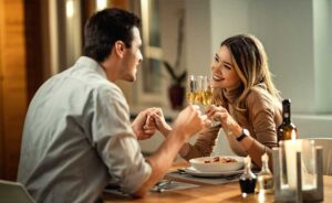 at home date night ideas man and woman having dinner