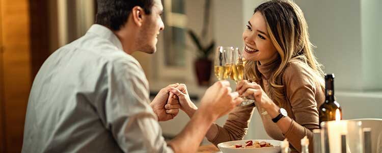 at home date night ideas man and woman having dinner