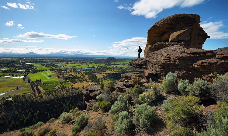 person enjoying the view fromone of the many Central Oregon hiking spots