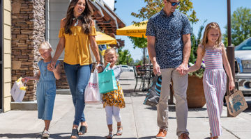 Family with young kids experiencing Bend shopping
